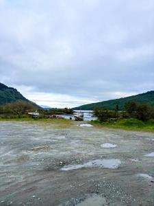 a large body of water with a boat in it at Cabañas Costanera Puyuhuapi in Puerto Puyuhuapi