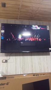 a flat screen tv sitting on top of a table at Cabañas Costanera Puyuhuapi in Puerto Puyuhuapi
