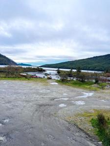 a body of water with boats in it at Cabañas Costanera Puyuhuapi in Puerto Puyuhuapi