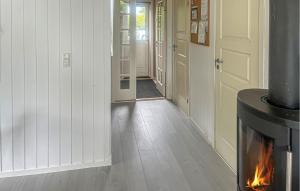 a hallway with a fireplace in a house at 4 Bedroom Cozy Home In Stege in Stege