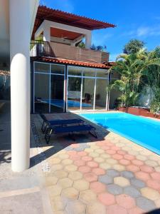 a villa with a swimming pool and a house at Huatulco house near beach with pool in Tangolunda