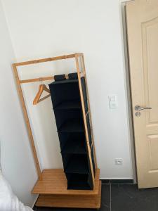 a book shelf in a room next to a door at Résidence les Jardins Secret in Romilly-sur-Seine +4 photos