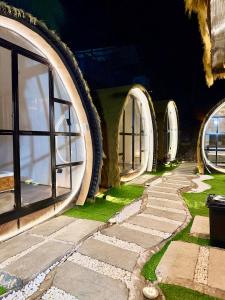 a room with two large windows and a walkway at Cocoon De Coron in Coron