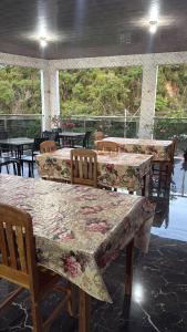 a group of tables and chairs in a restaurant at Caribe de Alter - Hotel & Pousada in Santarém +125 photos