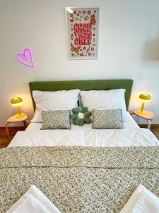 a bedroom with a bed with a flower on it at Sitka1 apartment in Trenčín