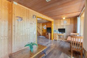 a room with a wooden wall with a wooden bench at Riverside Cabin with Private Fishing Access! in Pulaski