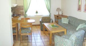 Posezení v ubytování Hotel Auf Dem Langenhof Wunstorf + 15 fotografií