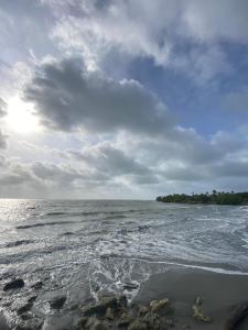 a view of the ocean on a cloudy day at Villa Neluc in San Bernardo del Viento