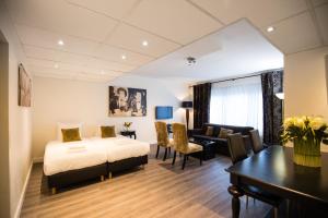 Postel nebo postele na pokoji v ubytování Hotel de Duif Lisse - Keukenhof