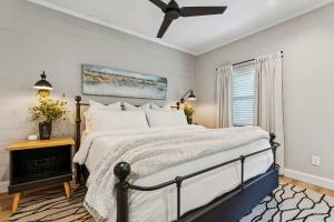 a bedroom with a bed and a ceiling fan at Loft Haven - Rooftop Terrace in Charlotte