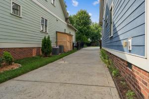 a sidewalk next to a house and a building at Loft Haven - Rooftop Terrace in Charlotte