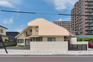 a house on the side of a street at Yunokawa Kagura in Hakodate