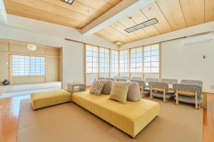 a living room with a couch and chairs at Yunokawa Kagura in Hakodate +41 photos