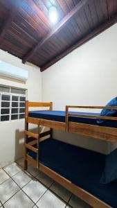 a pair of bunk beds in a room at Casa com piscina 20 Leitos in Cuiabá +30 photos