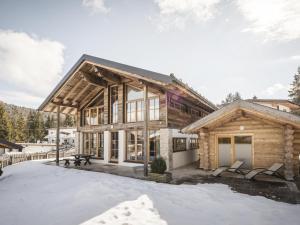 a log home in the snow at Modern chalet in the willow roof in Leutasch