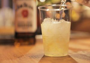 a drink in a glass with ice on a table at Super Hotel Sendai Hirose Dori in Sendai