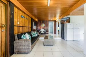 a living room with a couch and a table at A Lure - 100m to Main Beach in Agnes Water