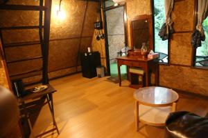 a room with a desk and a table and a chair at Hidden Gem Elephant in Chiang Mai +21 photos