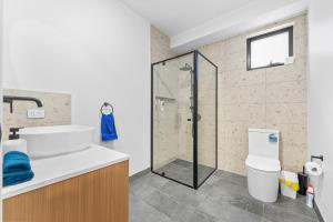 a bathroom with a shower and a toilet at Sleek Contemporary Haven Geelong in Highton +31 photos