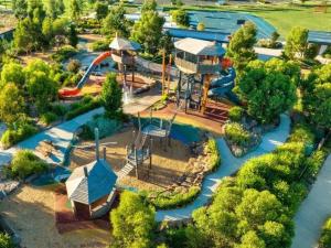 an aerial view of a water park with a water slide at Papillon Home in Rockbank