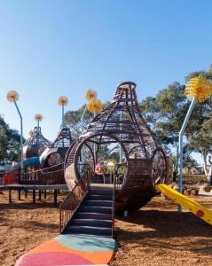 a playground with a slide and a staircase in a park at Papillon Home in Rockbank