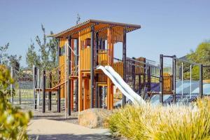 a playground with a slide in a park at Papillon Home in Rockbank