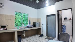 a bathroom with a sink and a window at F&D Homestay in Semporna