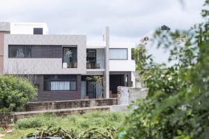 a house with a black and white facade at 晴井villa in Huxi