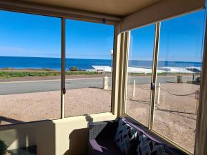 a view of the ocean from a room with windows at Sunsethome Wallaroo in Wallaroo
