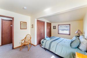 a bedroom with a bed and a chair in it at Ski Bowl Cottage! in Hunter