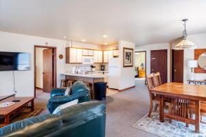 a living room with a couch and a table at Ski Bowl Cottage! in Hunter