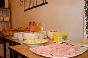 a table topped with bowls of food on a table at Machupicchu Royal Mountain in Machu Picchu