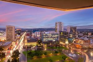 a view of a city skyline at night at Amora Hotel Adelaide in Adelaide +21 photos