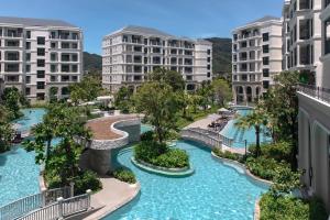 an aerial view of a water park with buildings at Title Legendary Studio with Balcony by TVC C407 in Bang Tao Beach
