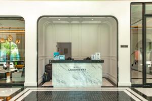 a lobby of a luxury hotel with a marble counter at Title Legendary Studio with Balcony by TVC C407 in Bang Tao Beach +89 photos