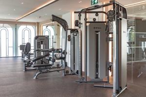 a gym with several tread machines in a room at Title Legendary Studio with Balcony by TVC C407 in Bang Tao Beach