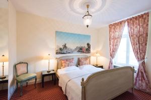 Cama ou camas em um quarto em DIRAZI Guesthouse & Apartments GmbH