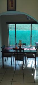 a table and chairs with a view of the ocean at RestZone Healing Guest Suite in Pietermaritzburg