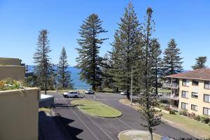arial view of a street with a parking lot at Seaspray 8 - Ocean Views - Stone Real Estate Yamba in Yamba