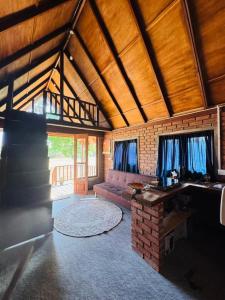 a living room with a couch and a table at Wild Roots Cabana Arugambay in Arugam Bay