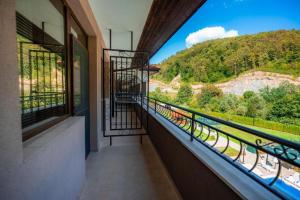 a balcony with a view of a mountain at Hotel Sveti Vasilii Veliki in Gabrovo