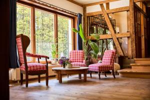 a room with two chairs and a table and a window at Hotel & Restaurant Rhönhäuschen in Bischofsheim an der Rhön