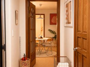 a door leading into a dining room with a table at Stay U in Suwon