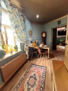 a living room with a table and a dining room at Apartamenty Traugutta 47 in Radom +24 photos