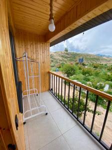 a room with a balcony with a view at Sarala Resort in Ostrov Kayrak