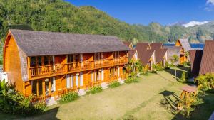 an aerial view of a resort with mountains in the background at The Dewi Tasik Kintamani Cabin and Villa in Kubupenlokan