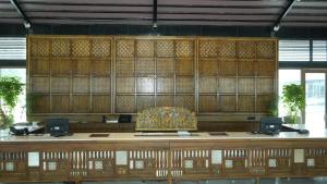 a desk with a chair in a large room at Evoke Rambagh Resort Ayodhya in Ayodhya