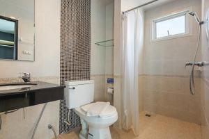 a bathroom with a toilet and a sink and a shower at Le Nara Residence in Jomtien Beach +35 photos