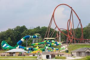 a water park with a water slide and roller coaster at Baymont by Wyndham Dale in Dale