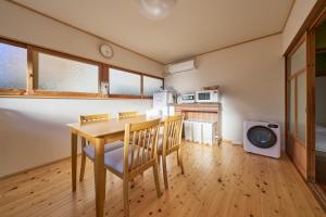 a kitchen and dining room with a table and chairs at SEN HAVEN Sakurai in Shingū +9 photos